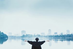 A woman looking over a city with confidence